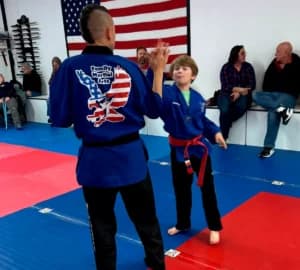 A family training together in martial arts class