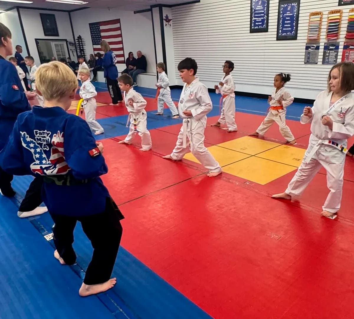 Kids martial arts students sparring in class